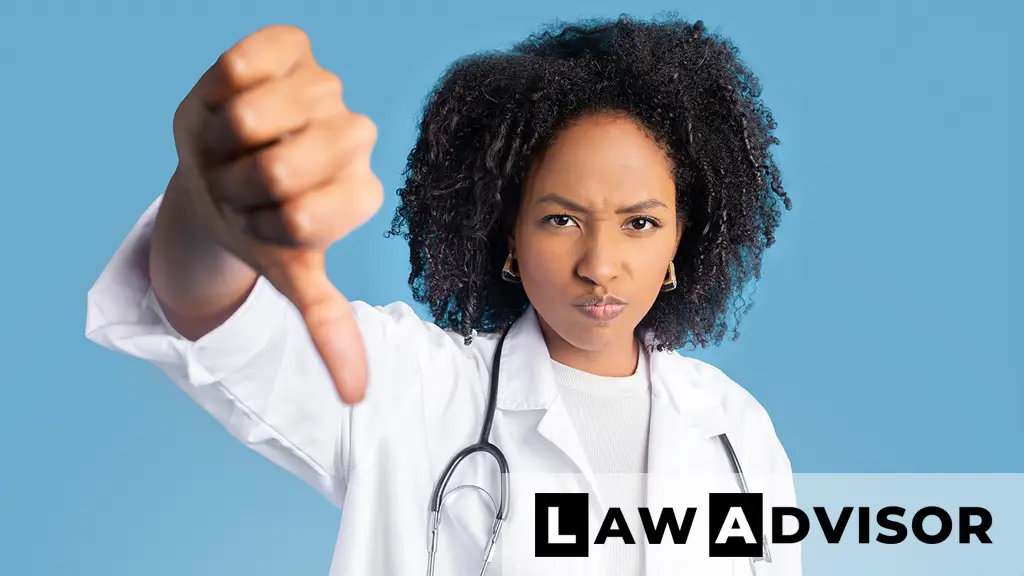 Frustrated young African American woman in medical office looking upset after denied health insurance claim