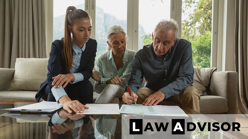 Senior couple signing estate planning documents with advisor, discussing revocable and irrevocable trusts