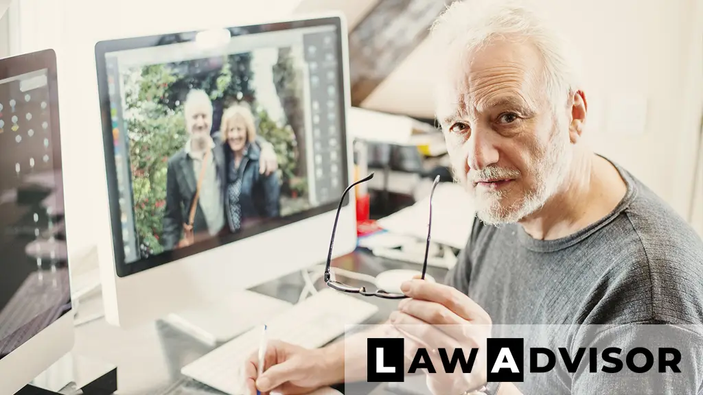 Senior man writing a will at his home desk, representing the concept of creating a DIY legally binding will.