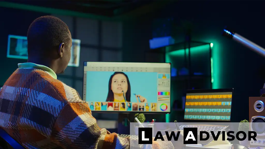 African-American designer editing images on a computer screen